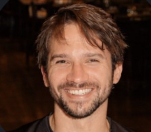 Ronnie smiling indoors